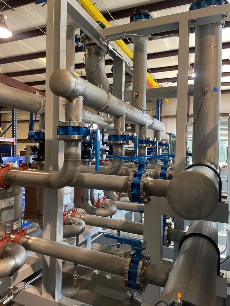 alt="complicated piping in an industrial plant"